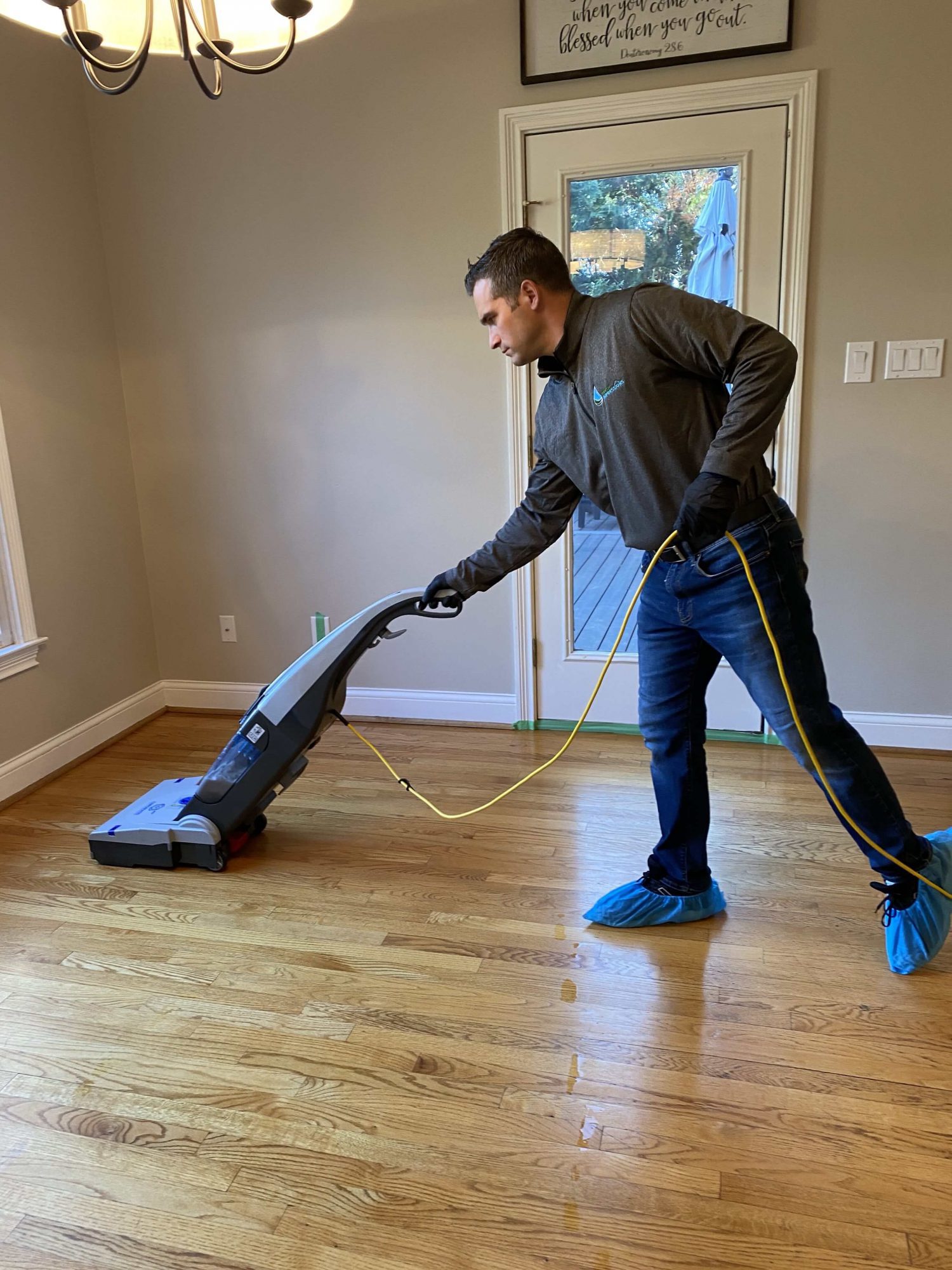 Ben Cleaning a Wood Floor